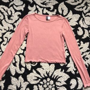 Pink lettuce hemmed long sleeved crop top